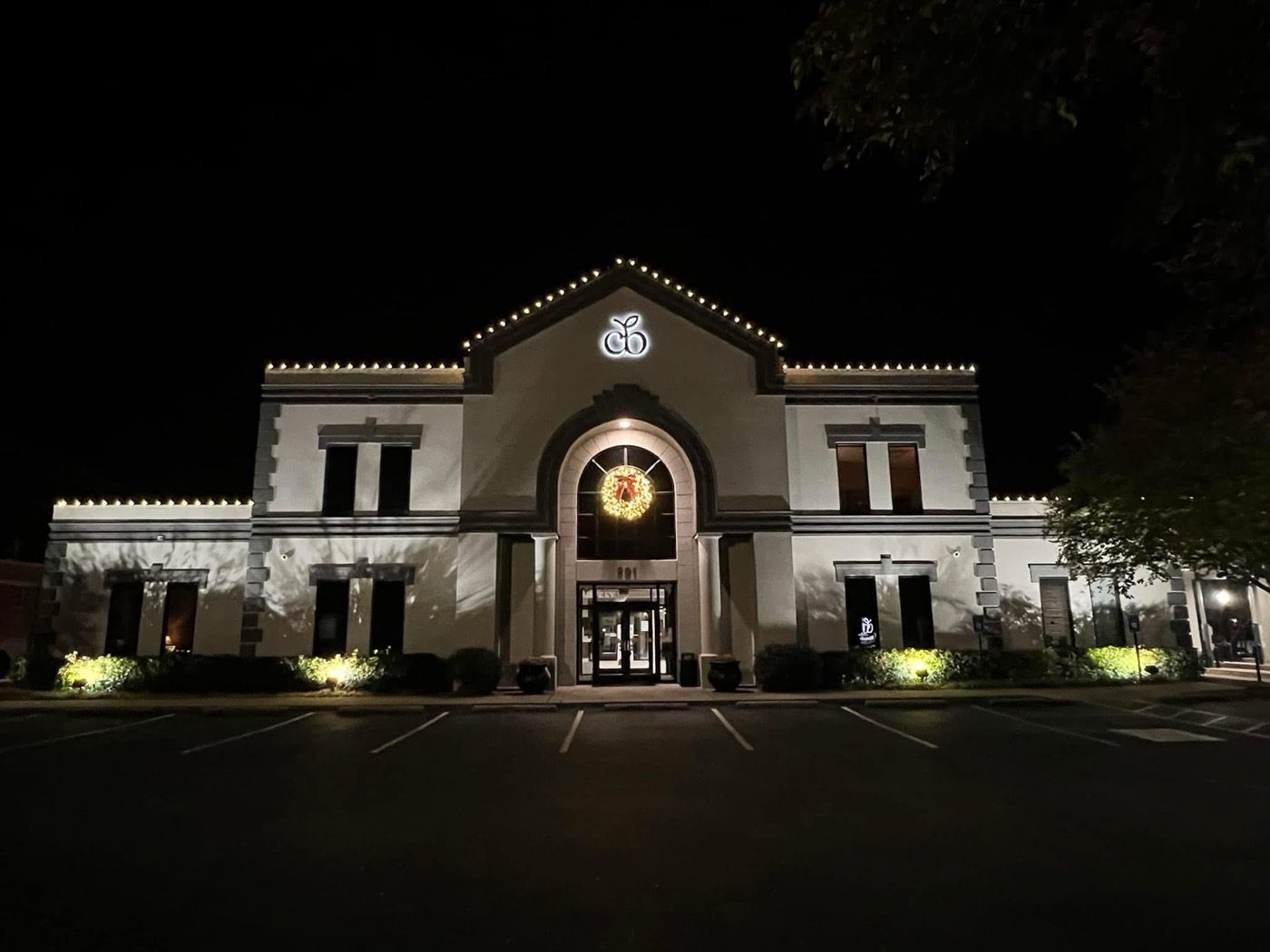 Office building with warm white holiday lighting