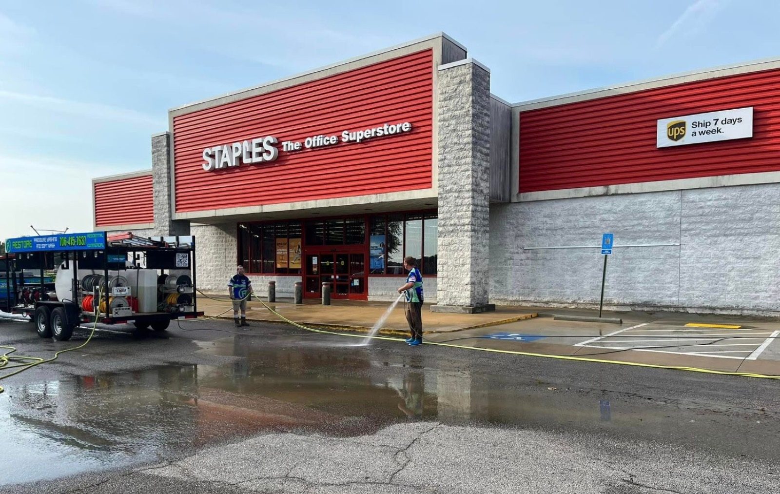 Restore trailer washing a Staples storefront